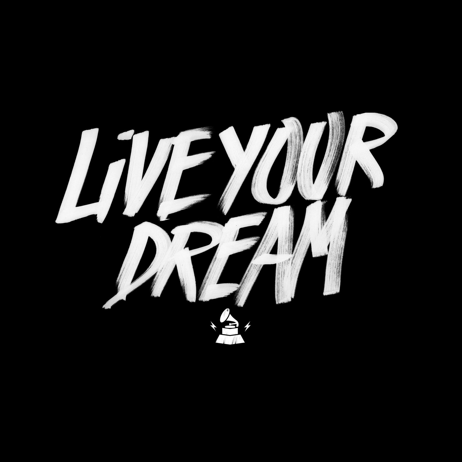 Bold, white brushstroke letters on a black background spell out "LIVE YOUR DREAM." A small icon of a rocket at the bottom adds emphasis to the motivational message.