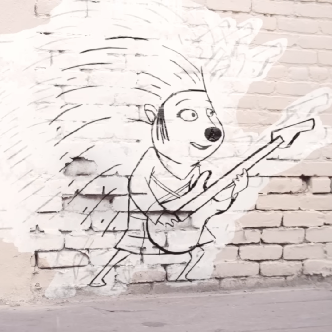 Street art of a porcupine holding a guitar. The porcupine has spiky quills and is drawn in a sketchy style on a brick wall. The guitar is detailed, and the porcupine appears to be playing energetically. Background is a lightly weathered brick wall.