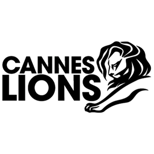The image shows the Cannes Lions logo. The logo features the words "Cannes Lions" in bold, uppercase black letters on the left. To the right, there is a stylized drawing of a lion's head and paw in black.
