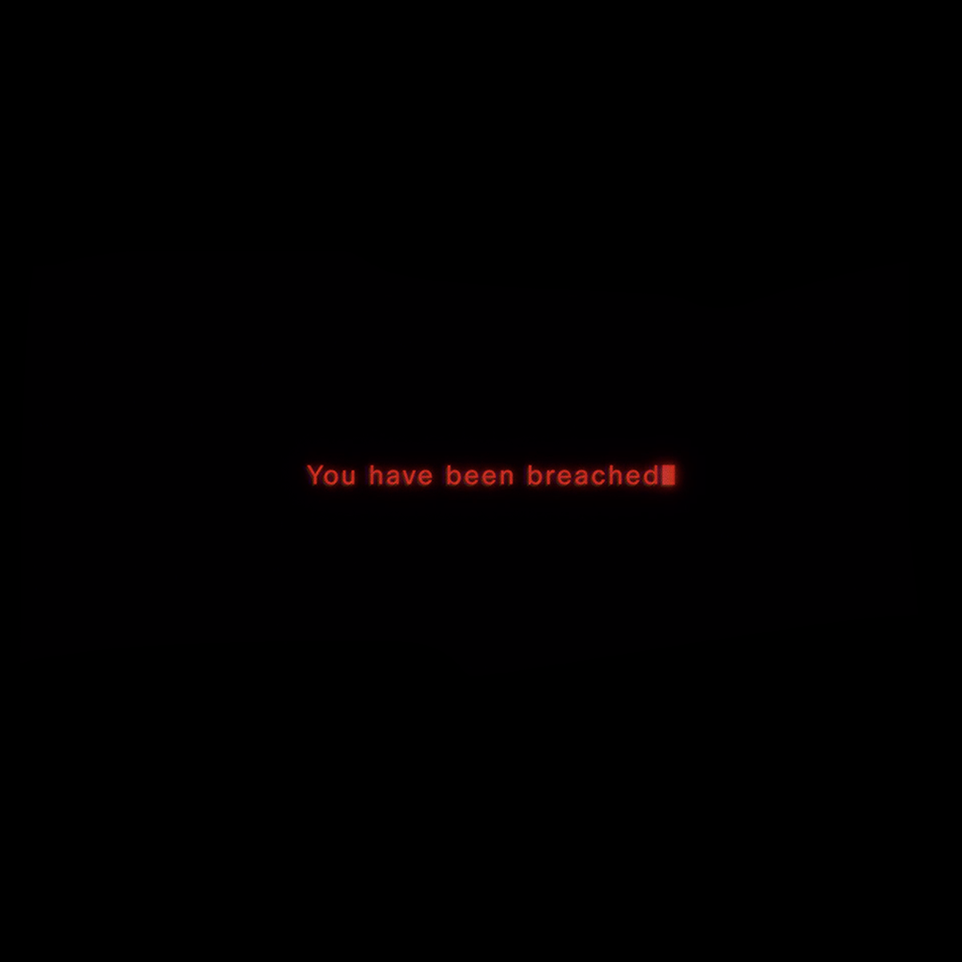 A black screen with a red text message in the center that reads "You have been breached," the letters flickering convey a sense of alarm or warning.